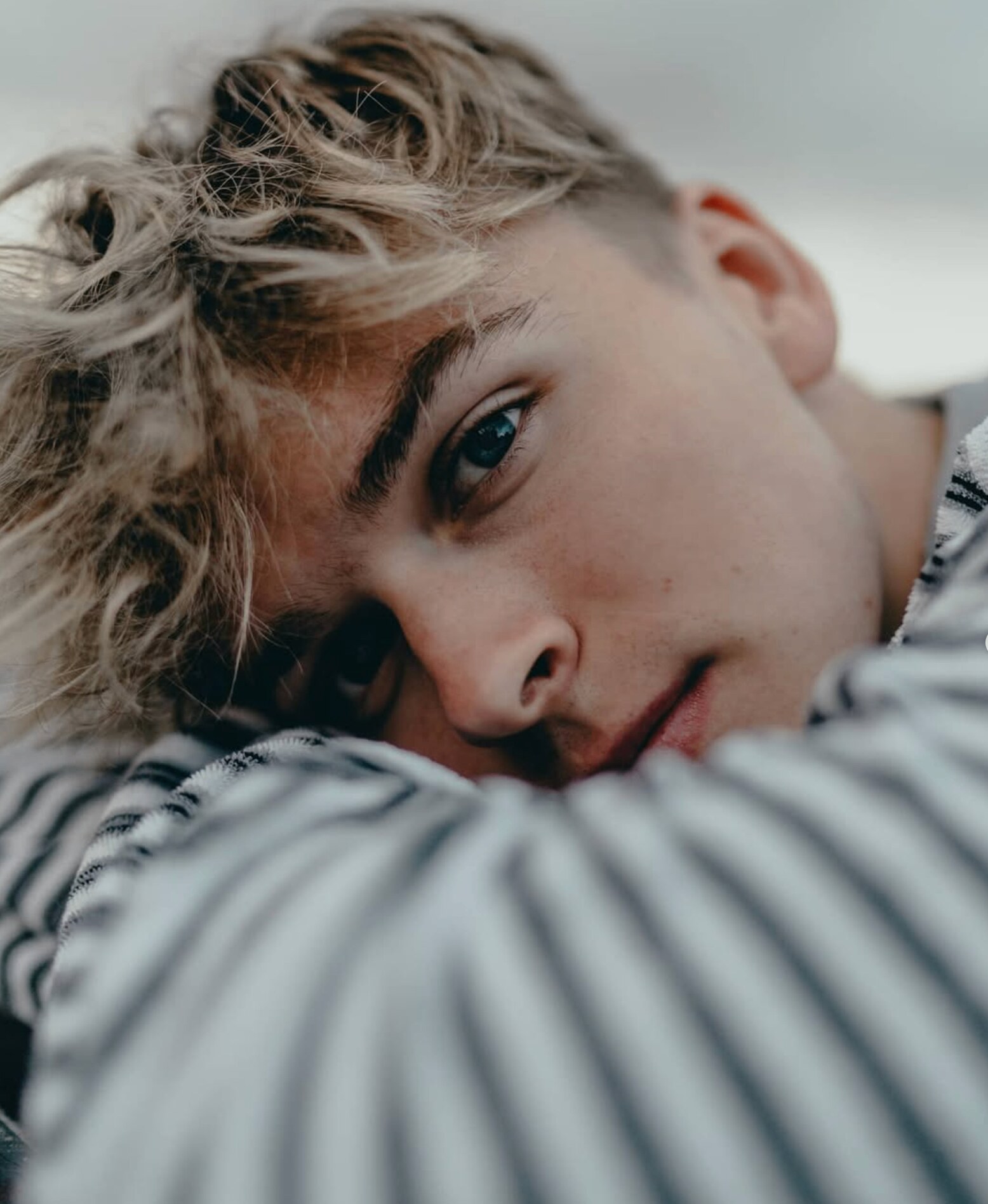 Intimate close-up portrait with soft focus foreground