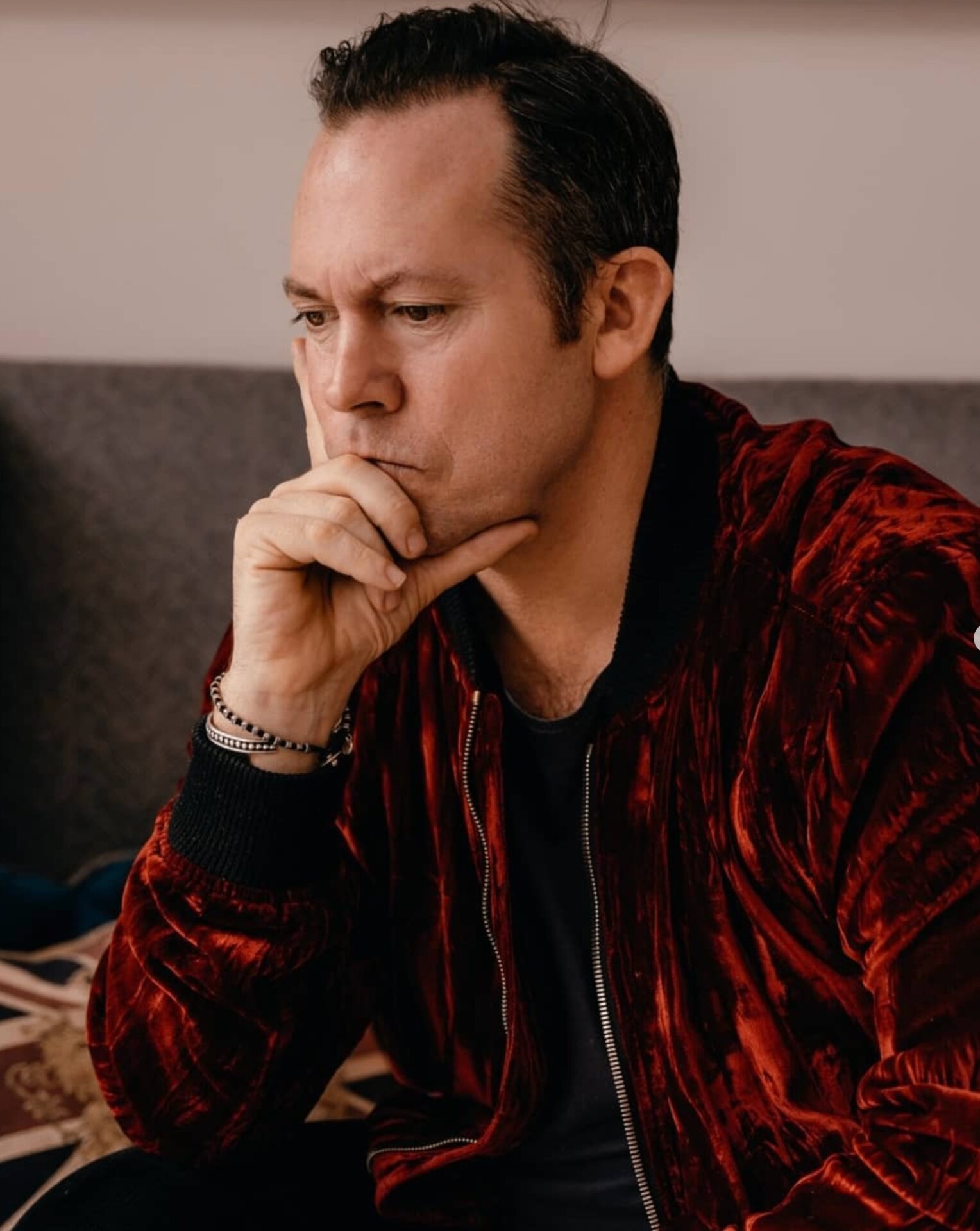 Portrait of a man in a red velvet jacket